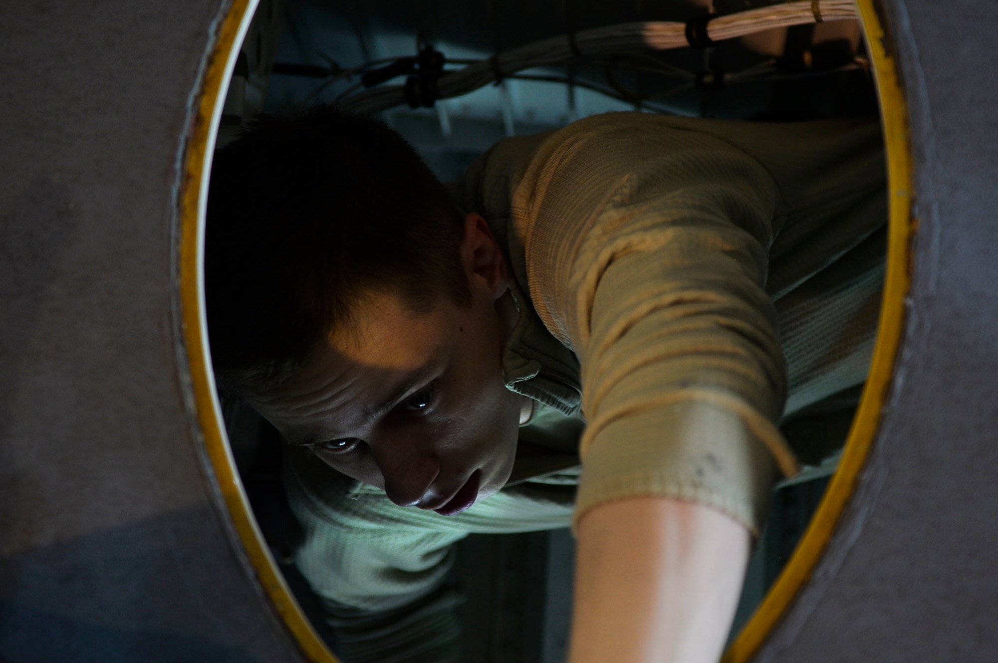 U.S. Air Force Airman 1st Class Kyle Brosa, 86th Maintenance Squadron fuel specialist, climbs out of the wing of a C-130J Super Hercules during an isochronal inspection on Ramstein Air Base, Germany, April 10, 2018. Inspections can last from several days to two weeks depending on what is being done. (U.S. Air Force photo by Senior Airman Joshua Magbanua)