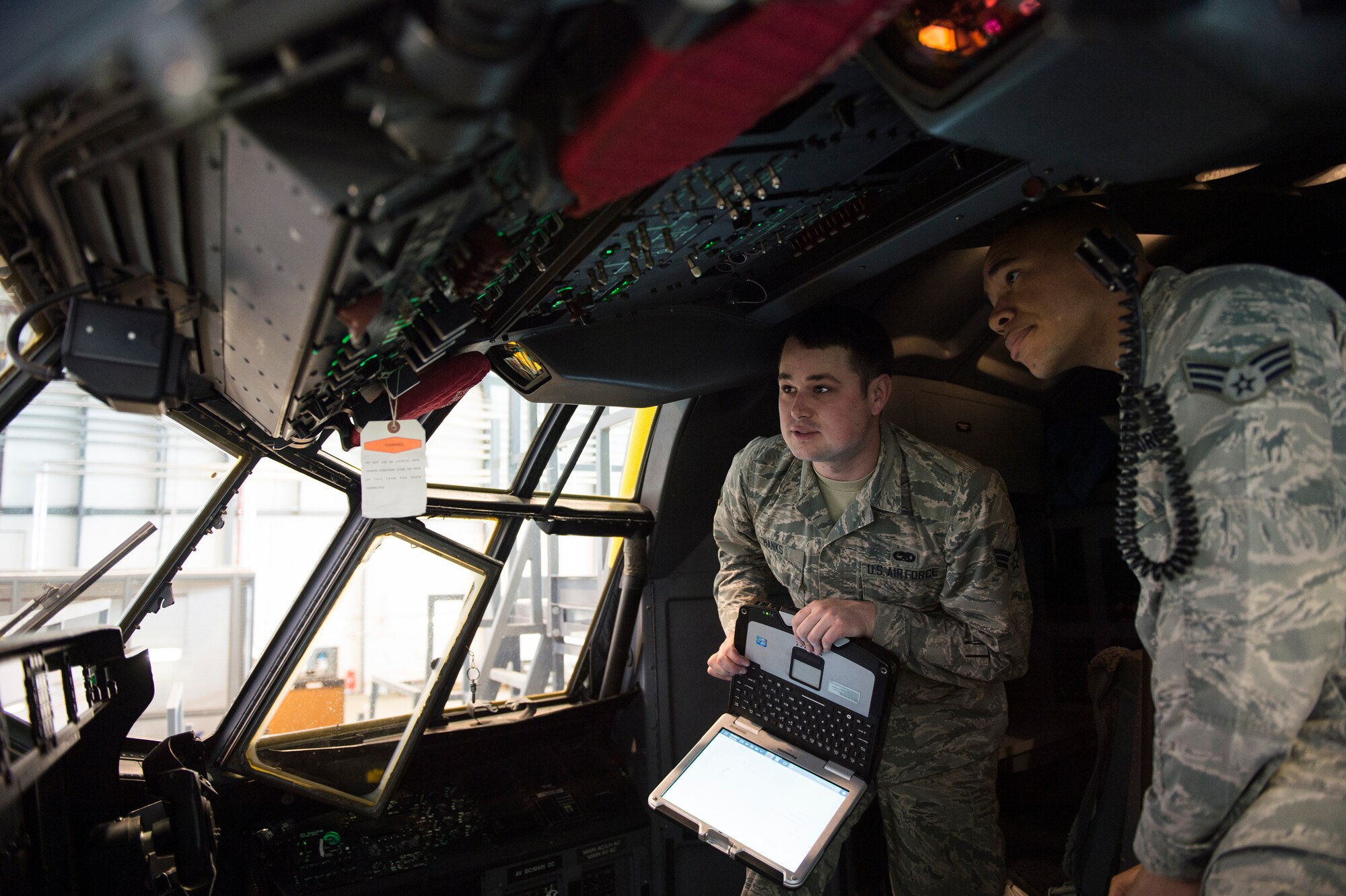 U.S. Airmen assigned to the 86th Maintenance Squadron test the computer systems of a C-130J Super Hercules cockpit on Ramstein Air Base, Germany, April 10, 2018. Due to their frequent use, aircraft require periodic inspection and maintenance to ensure their reliability. (U.S. Air Force photo by Senior Airman Joshua Magbanua)