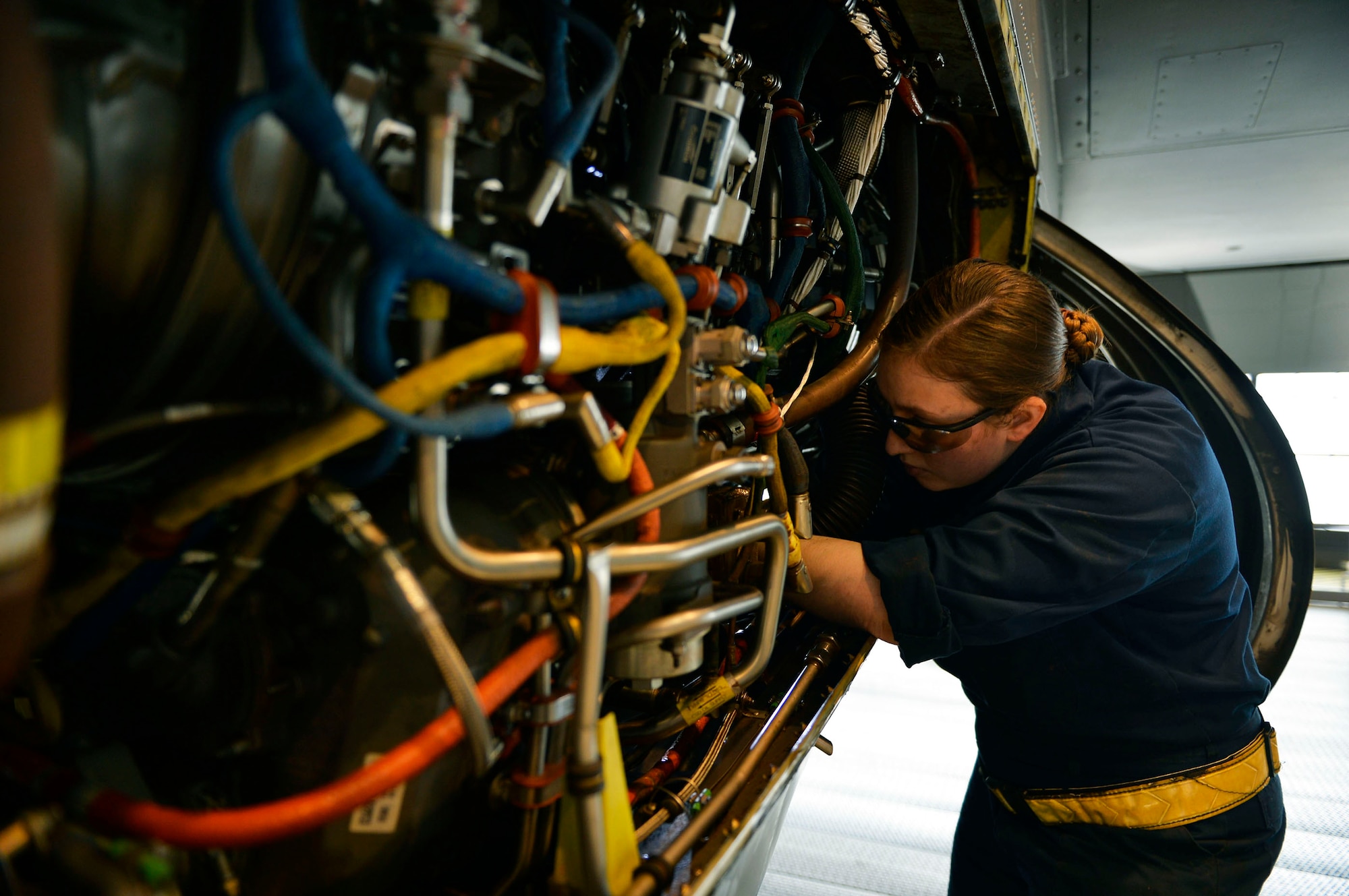 U.S. Air Force Staff Sgt. Rachel Revels, 86th Maintenance Squadron aerospace propulsion specialist, conducts maintenance work on a C-130J Super Hercules on Ramstein Air Base, Germany, April 10, 2018. As the latest model in the C-130 series, the C-130J features a longer fuselage, upgraded avionics, and improved flight and landing performance. (U.S. Air Force photo by Senior Airman Joshua Magbanua)