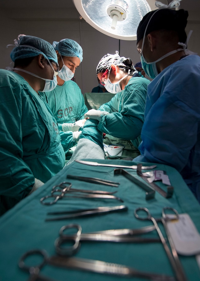 Doctors perform surgery on a patient in Guatemala.