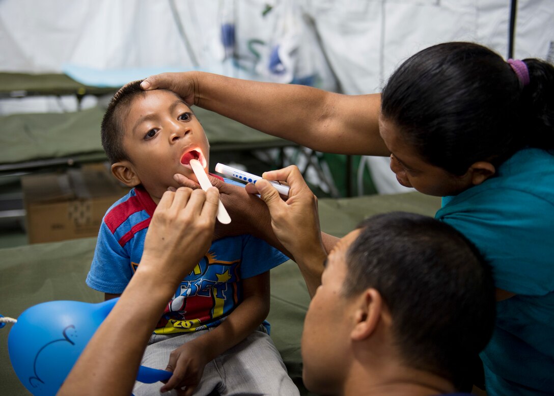 Doctors check a patient in Guatemala.