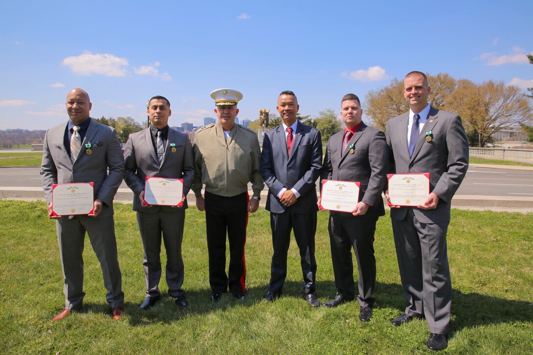 Sgt. Maj. Mike Lanpolsaen and Maj. Gen. Paul Kennedy pose with the four Marine Corps Recruiting Command (MCRC) Marines recognized as recipients of Commandant of the Marine Corps Combined Awards Program 2018 awards at the Lincoln Memorial, April 10. The awards presented included Recruiter of the Year, Prior Service Recruiter of the Year, Prior Service Recruiter Staff Non-Commissioned Officer in Charge of the Year and Staff Non-Commissioned Officer in Charge of the Year. (U.S. Marine Corps photo by Cpl. Michael McHale)