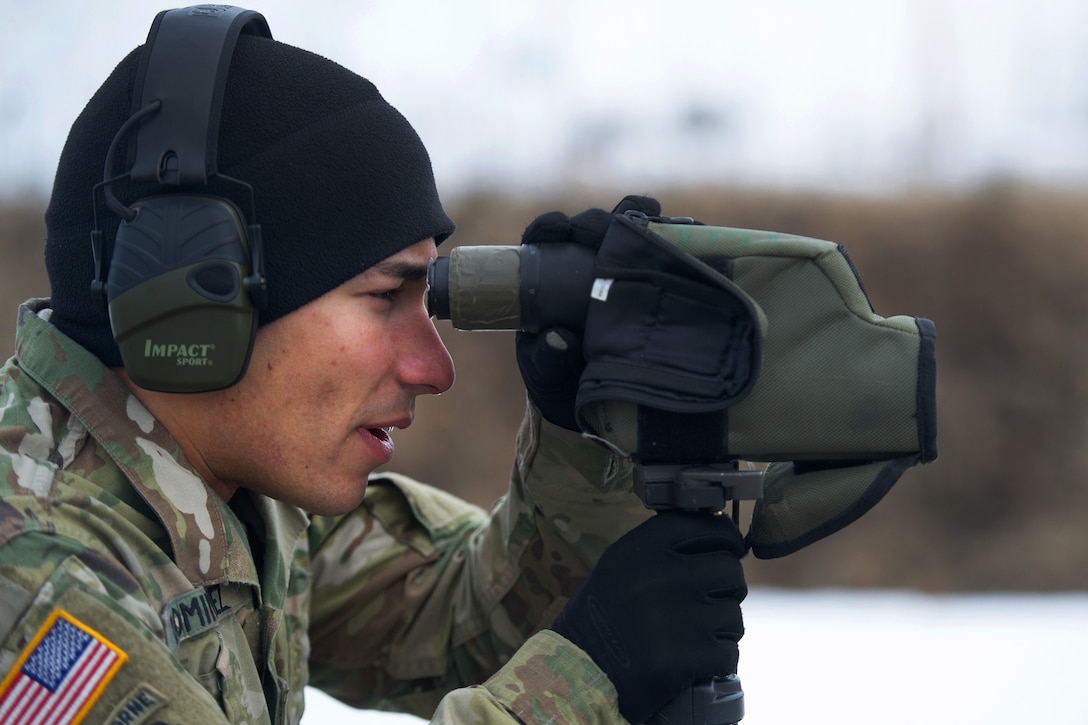 A soldier observes a target.