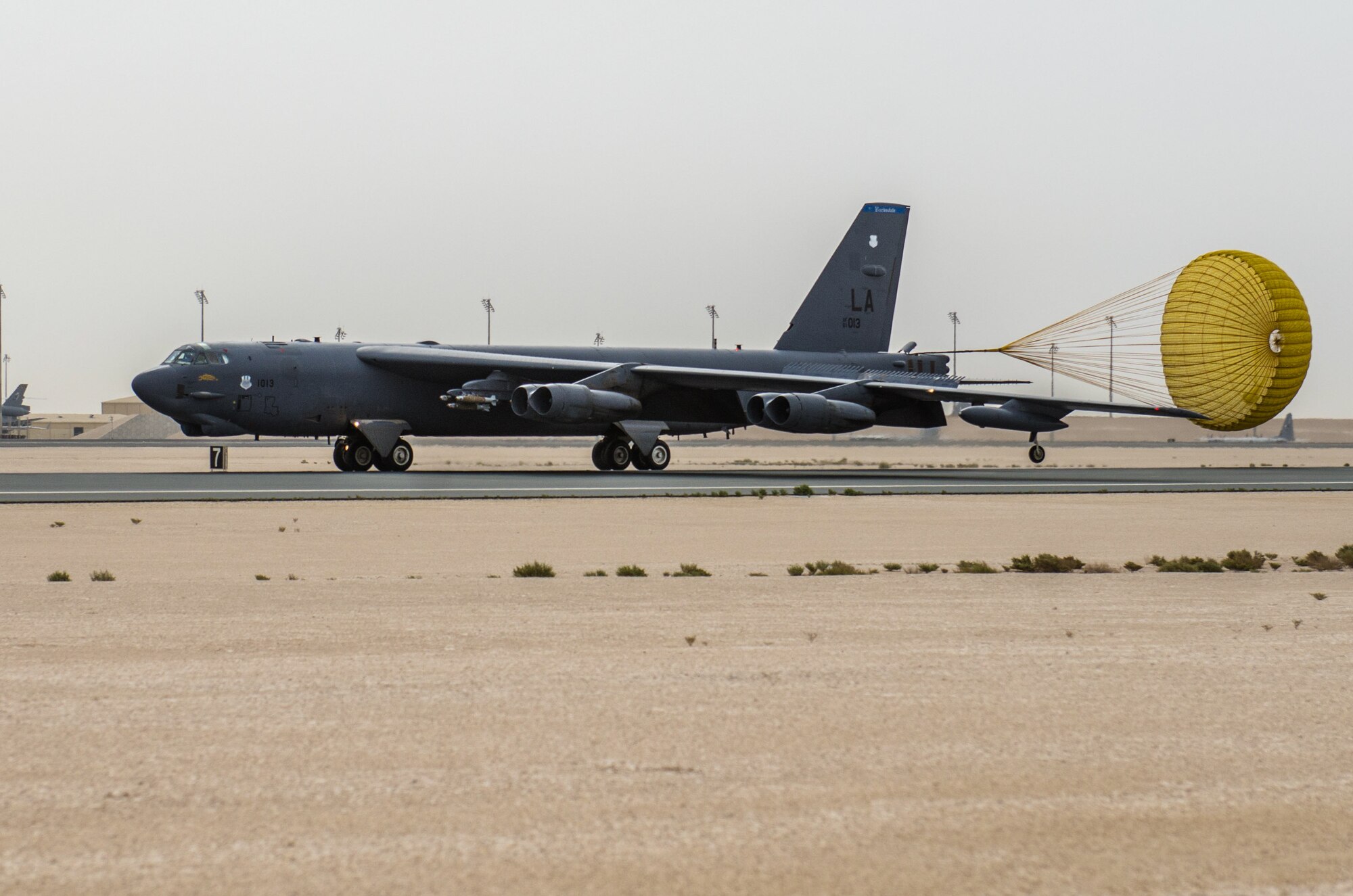 A B-52 Stratofortress aircraft assigned to the 69th Expeditionary Bomb Squadron lands at Al Udeid Air Base, Qatar, April 8, 2018, signifying the completion of its last sortie here before turning over the bomber mission to the newly arrived B-1B Lancer.  Since its arrival in 2016, the BUFF flew more than 1,800 sorties and employed nearly 12,000 weapons against ISIS and Taliban targets. (U.S. Air Force photo by Staff Sgt. Patrick Evenson)