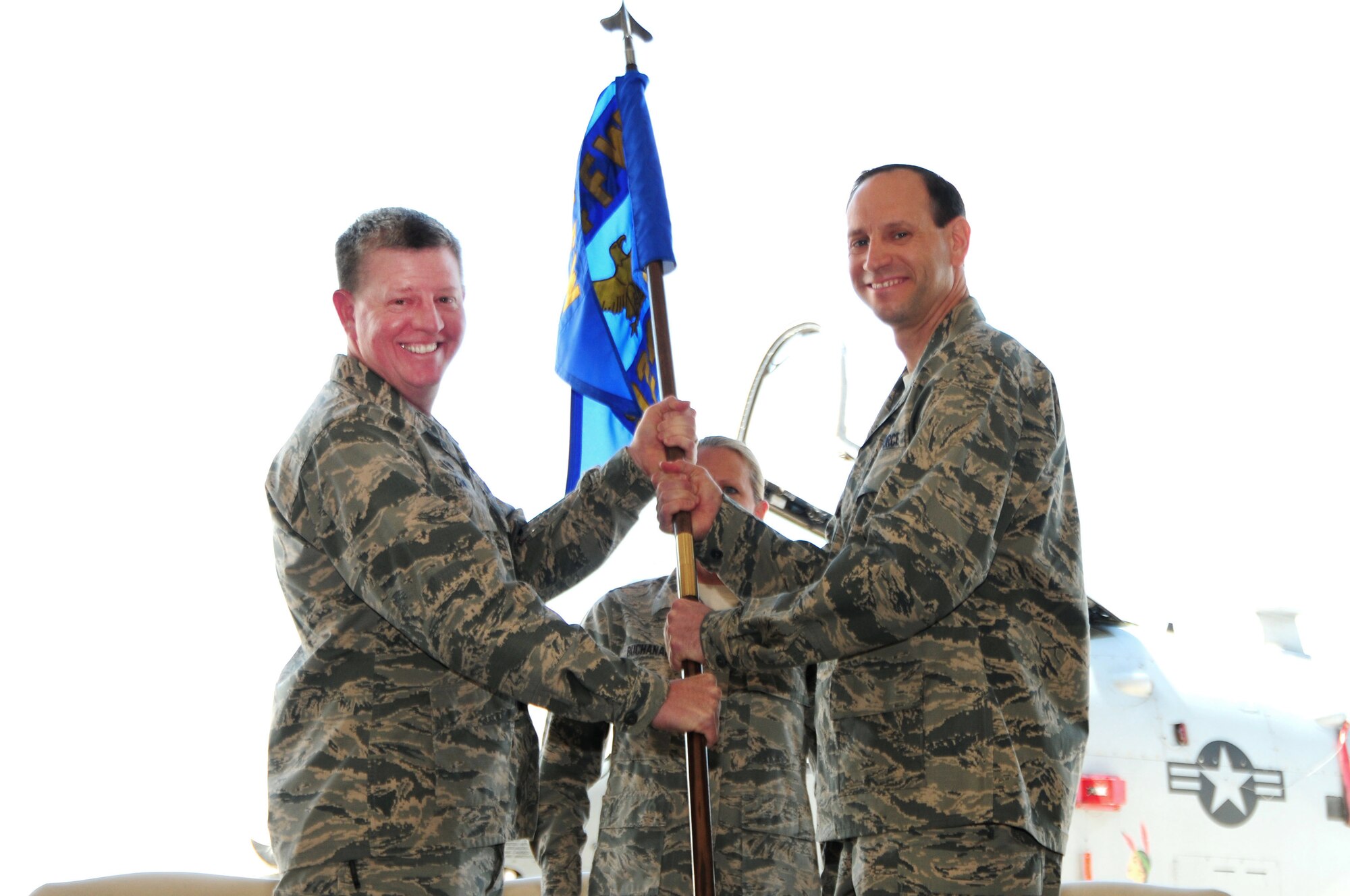 Col. Brian Cusson, 924th Fighter Group incoming commander, assumes command of the group from Col. Bryan Cook, 944th Fighter Wing commander, during a ceremony, April 7, 2018.