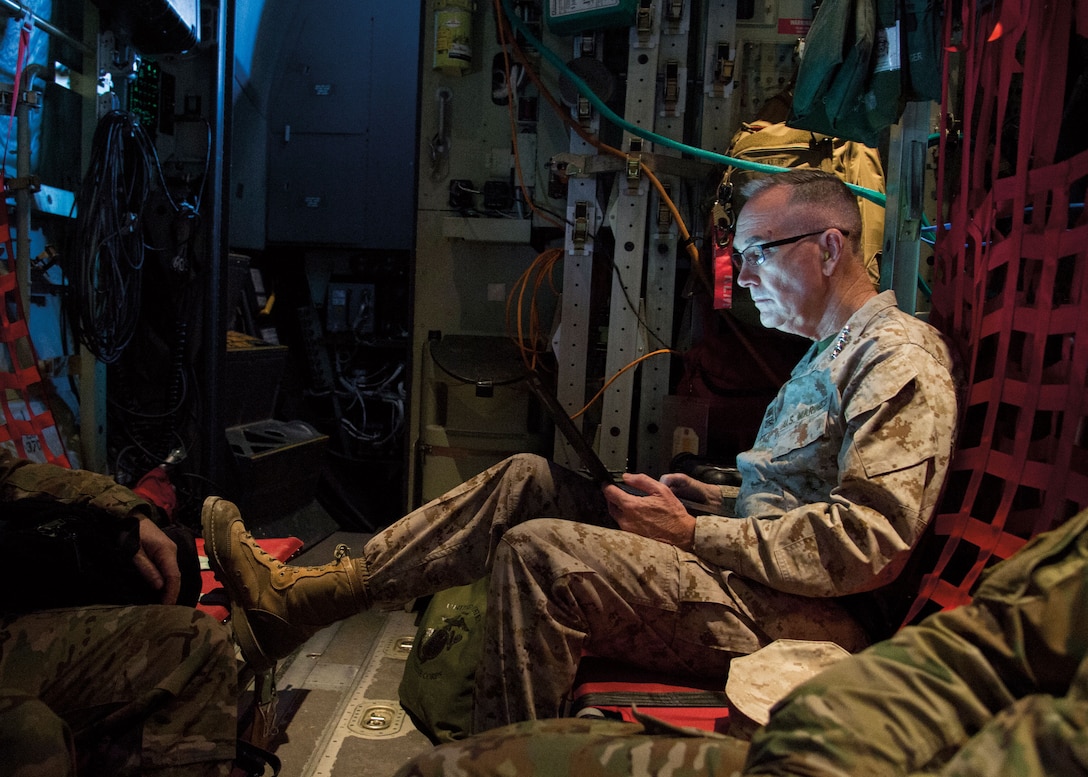 General Dunford works aboard C-130 aircraft at Bagram Airfield before visit to Task Force–Southwest at Camp Shorab, Helmand Province, March 22, 2018 (DOD/Dominique A. Pineiro)