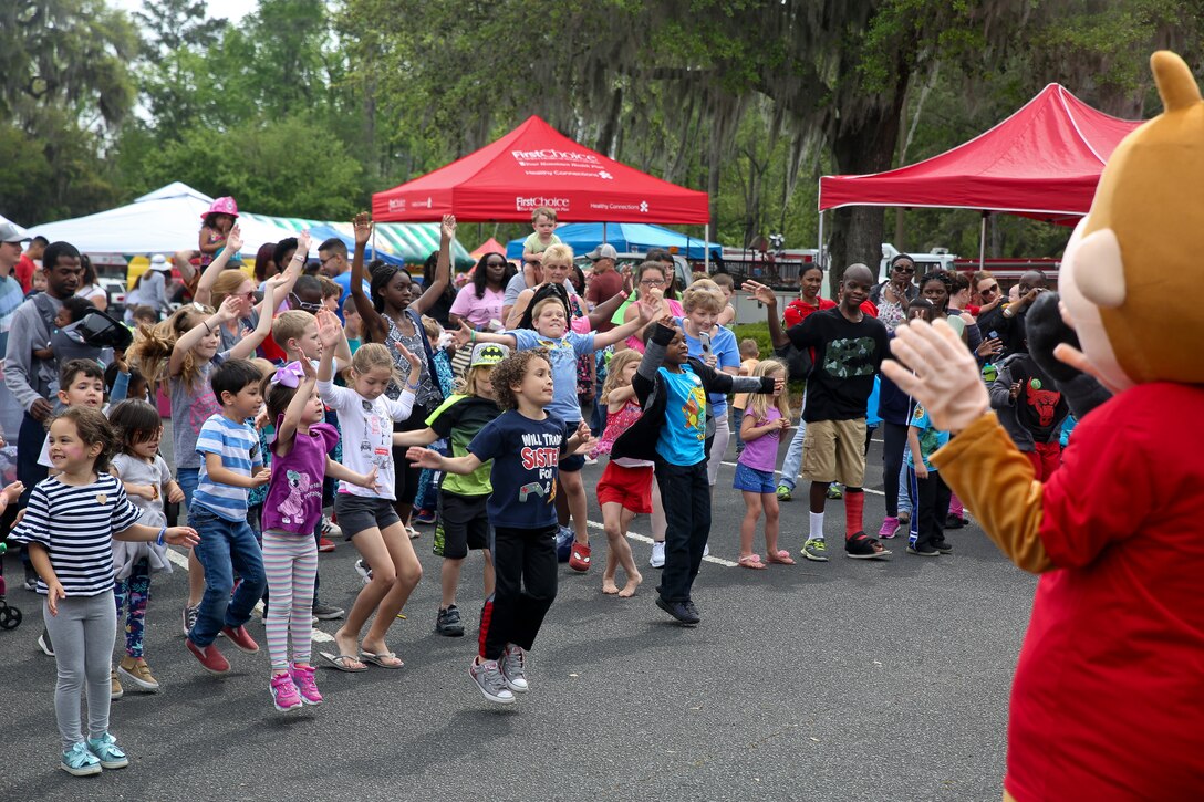 Kids participate in a dance party during Kids Fest in downtown Beaufort, April 7. April is Month of the Military Child and Child Abuse Prevention Month. Marine Corps Community Services hosted the event, organizing informational booths, resources and entertainment.
