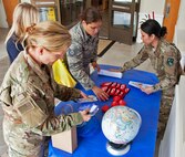 Members of the 919th Special Operations Force Support Squadron's Airmen and Family Readiness Center set up a display spotlighting April as The Month of the Military Child