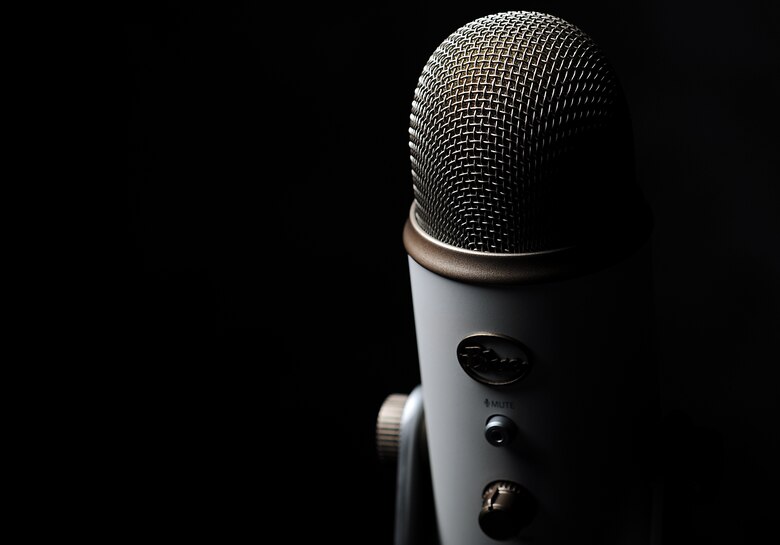 U.S. Air Force Airman 1st Class John Cone writes and reads one of his slam poetry pieces.