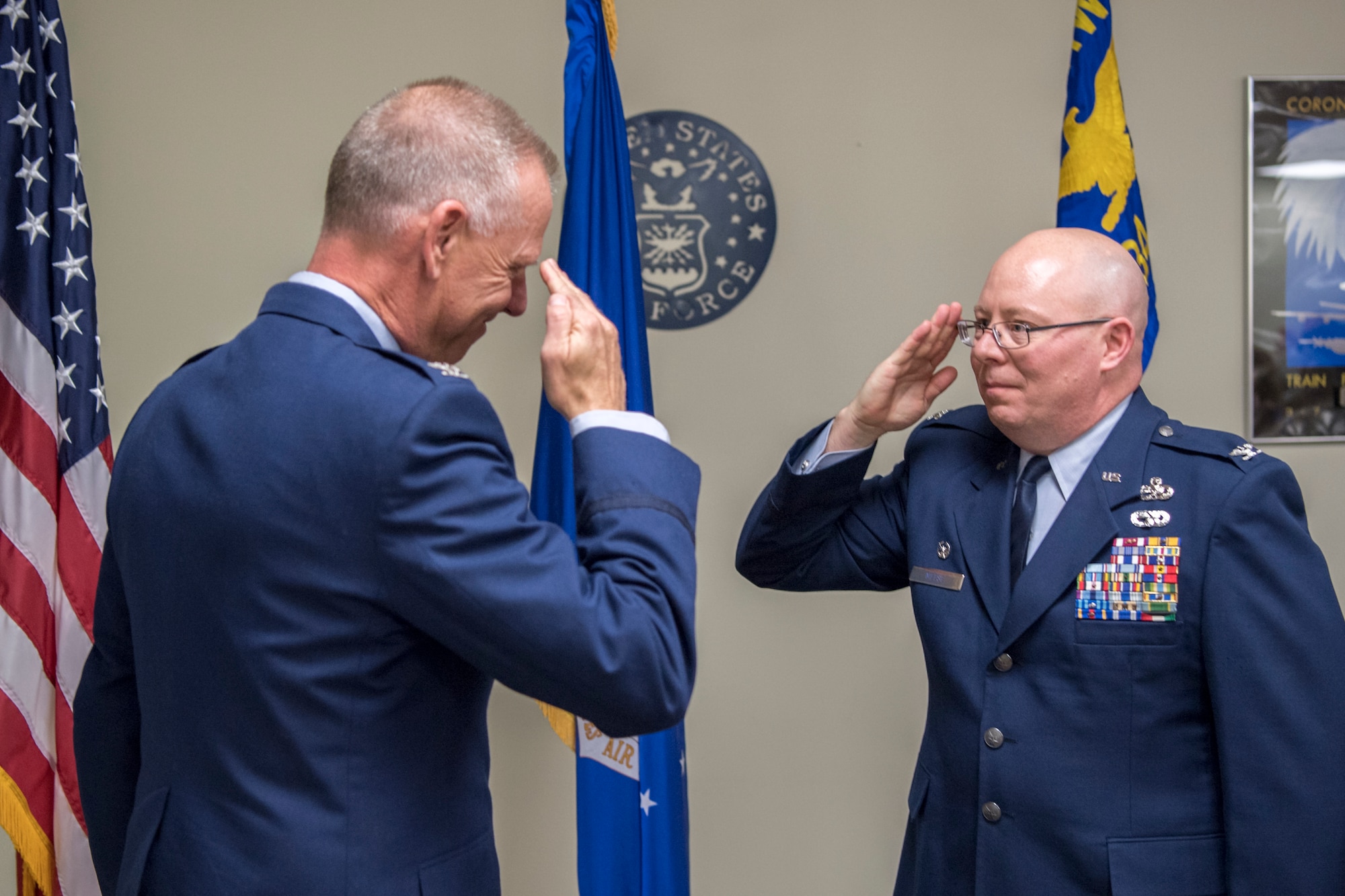 Col. Dwight Meese, 434th Maintenance Group commander, right, renders his first salute as a colonel to Col. Larry Shaw, 434th Air Refueling Wing commander, following his administration of the oath of office during a pin-on ceremony at Grissom Air Reserve Base, Ind., April 7, 2018. Meese initially enlisted in the Air Force as a C-130 mechanic in 1991 before receiving his commission in 2000. (U.S. Air Force photo/Tech. Sgt. Benjamin Mota)