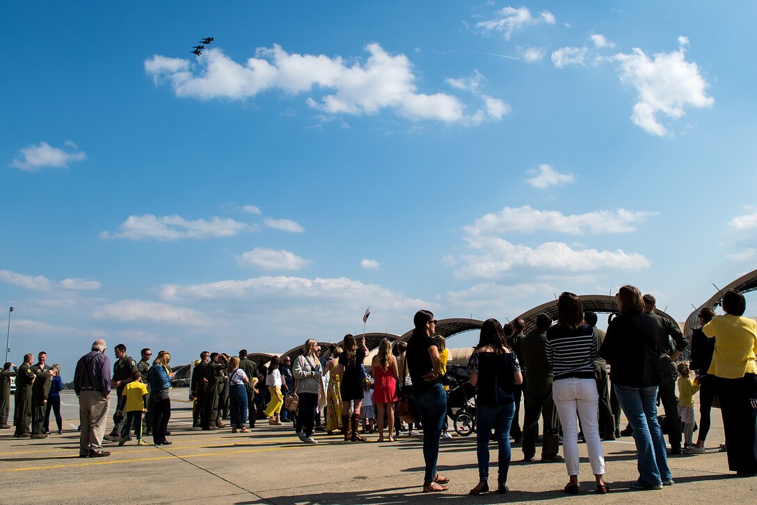 Families and friends wait for Airmen from the 336th Fighter Squadron to land, April 11, 2018, at Seymour Johnson Air Force Base, North Carolina.