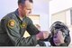 Maj. Shayne Carroll, 4th Fighter Squadron, demonstrates his F-35 helmet to Seth Rushton, a 5th grader from Snow Horse Elementary in Kaysville, Utah. Carroll represented Hill Air Force Base during the grand opening of Junior Achievement City's model air traffic control tower in Salt Lake City. The tower was built courtesy of Hill Air Force Base. The JA City is an interactive learning environment where students learn about real-life careers.(U.S. Air Force photo by Cynthia Griggs)