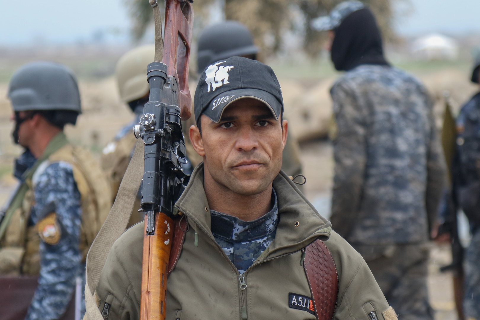 Member of Iraqi federal police awaits next movement on streets of recently secured airport during offensive to liberate West Mosul, March 2, 2017 (U.S. Army/Jason Hull)