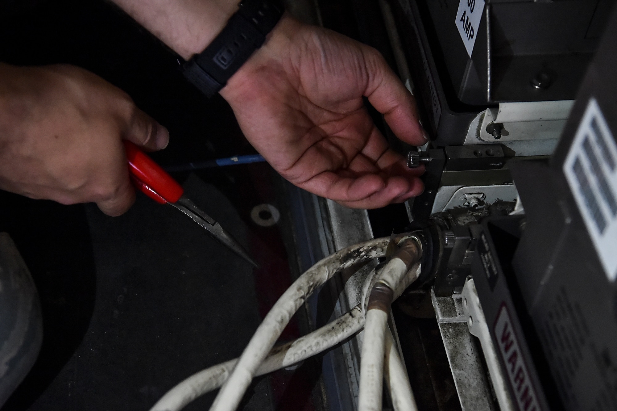 Senior Airman Ethan Fite, 437th Aircraft Maintenance Squadron crew chief, replaces a battery on a C-17 Globemaster III at Joint Base Charleston, S.C., April 4, 2018.