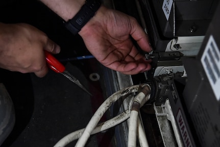 Senior Airman Ethan Fite, 437th Aircraft Maintenance Squadron crew chief, replaces a battery on a C-17 Globemaster III at Joint Base Charleston, S.C., April 4, 2018.