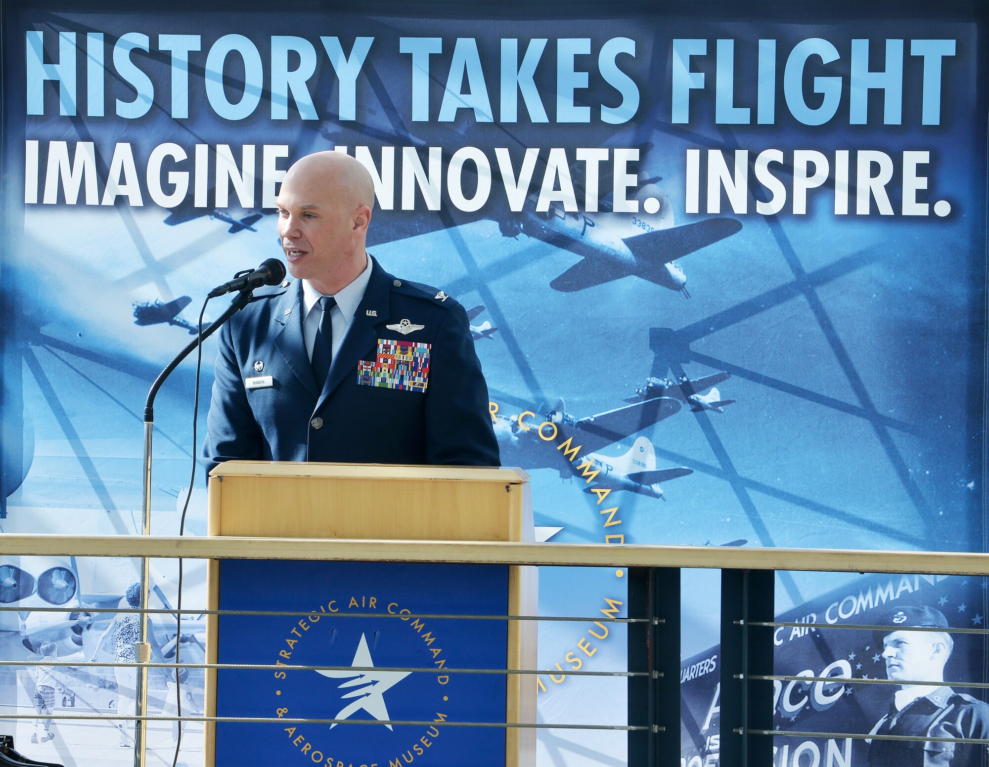 Col. Michael Manion, 55th Wing commander, gives opening remarks to a crowd during the War and Peace event commemorating the 70th anniversary of the U.S. Air Force and 100th anniversary of the U.K. Royal Air Force ceremony on April 7, 2018 inside the Strategic Air and Space Museum in Ashland, Nebraska.