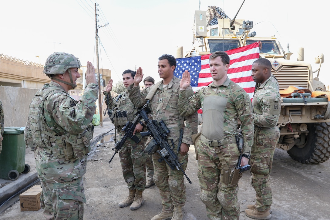 Commander of Combined Joint Task Force–Operation Inherent Resolve and XVIII Airborne Corps reenlists paratroopers of 2nd Battalion, 325th Airborne Infantry Regiment, 2nd Brigade Combat Team, 82nd Airborne Division, near Bartallah, Iraq, February 1, 2017 (U.S. Army/Loni Ayers)