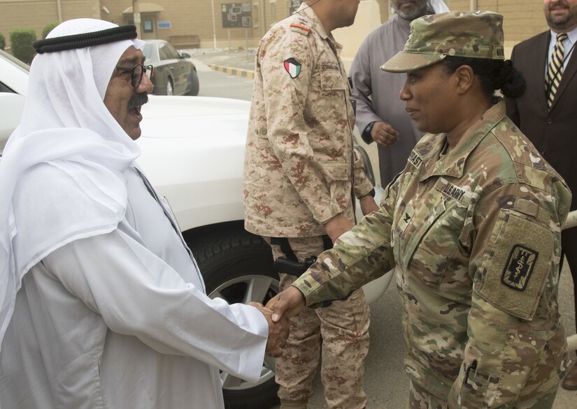 Col. Jennifer Marrast-Host, commander of the Combat Support Hospital, greets Shaykh Nasser,  First Deputy Prime Minister and Minister of Defense Kuwait, before giving him a tour of the troop medical clinic at Camp Arifjan, Kuwait, April 11, 2018. The minister toured three key points in the facility that demonstrated the hospital’s range of medical capabilities.