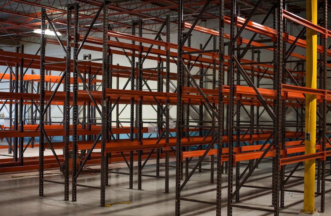 Shelving units remain empty prior to assembly inside the 6th Logistics Readiness Squadron warehouse at MacDill Air Force Base, Fla., April 11, 2018.