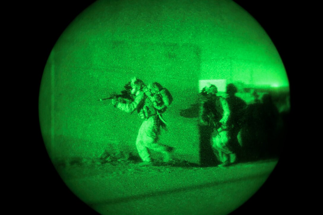 NATIONAL TRAINING CENTER, ISRAEL (March 13, 2018) U.S. Marines assigned to Battalion Landing Team, 2nd Battalion, 6th Marine Regiment (BLT 2/6), 26th Marine Expeditionary Unit maneuver around a building during exercise Juniper Cobra 2018 at the National Training Center in Israel, March 13, 2018. Juniper Cobra is a computer-assisted exercise conducted through computer simulations focused on improving combined missile defense capabilities and overall interoperability between the U.S. European Command and Israel Defense Force. (U.S. Marine Corps photo by Cpl. Jon Sosner/Released)