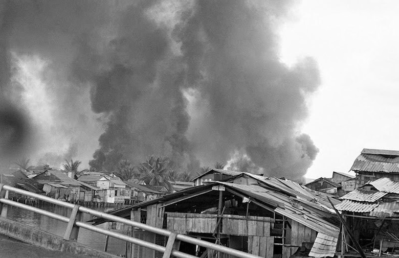 U.S. Marines and Vietnamese troops move through the grounds of the Imperial Palace in the old citadel area of Hue, Vietnam, Feb. 26, 1968, after seizing it from Communist hands. The heavy damage was the result of the artillery, air, and mortar pounding the area for 25 days while the Viet Cong and North Vietnamese Army held the area.