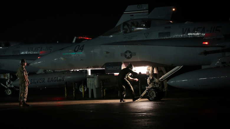 Maintainers prepare an F/A-18C Hornet for takeoff aboard Marine Corps Air Station Beaufort, April 9. The Hornet is with Marine Fighter Attack Squadron 115 and deployed in support of combat operation overseas. While deployed, the squadron will coordinate with our international partners and other branches of the U.S. military in order to ensure the mission is accomplished and freedom is protected.