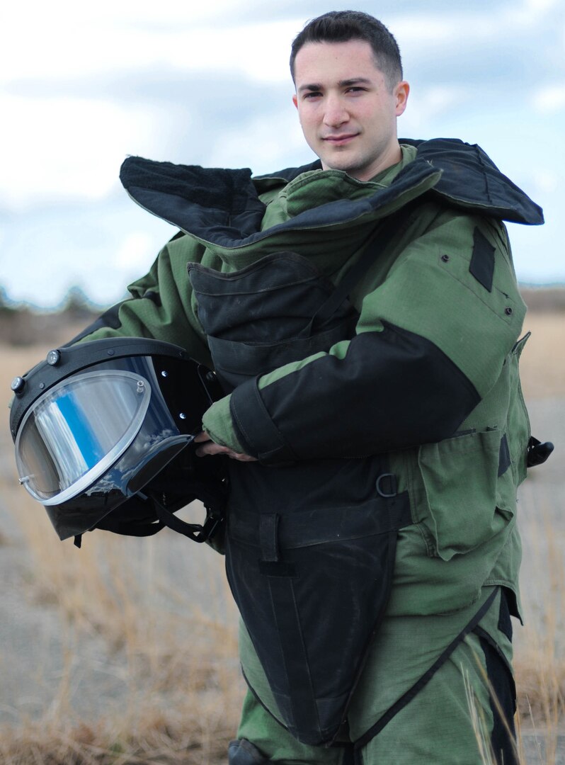 Army 1st Lt. Joe Fortini, an explosive ordinance qualified officer, suits up in full protective gear April 11, 2018 at Camp Edwards, Massachusetts.