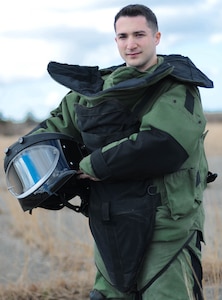 Army 1st Lt. Joe Fortini, an explosive ordinance qualified officer, suits up in full protective gear April 11, 2018 at Camp Edwards, Massachusetts.