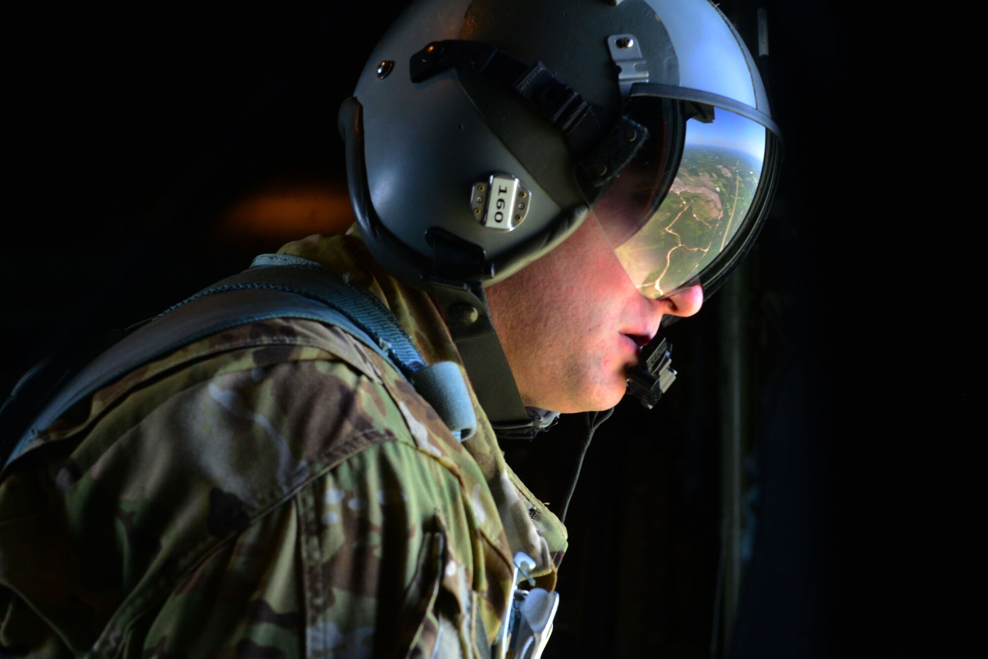 Staff Sgt. Michael Demik, 39th Airlift Squadron evaluator loadmaster, surveys an area during Green Flag Little Rock April 10, 2018, near Alexandria, La. Green Flag allows the Air Force to work with sister services and partners in the Mobility Air Forces to prepare mobility Airmen for real-world threats. (U.S. Air Force Photo by Airman 1st Class Codie Collins)
