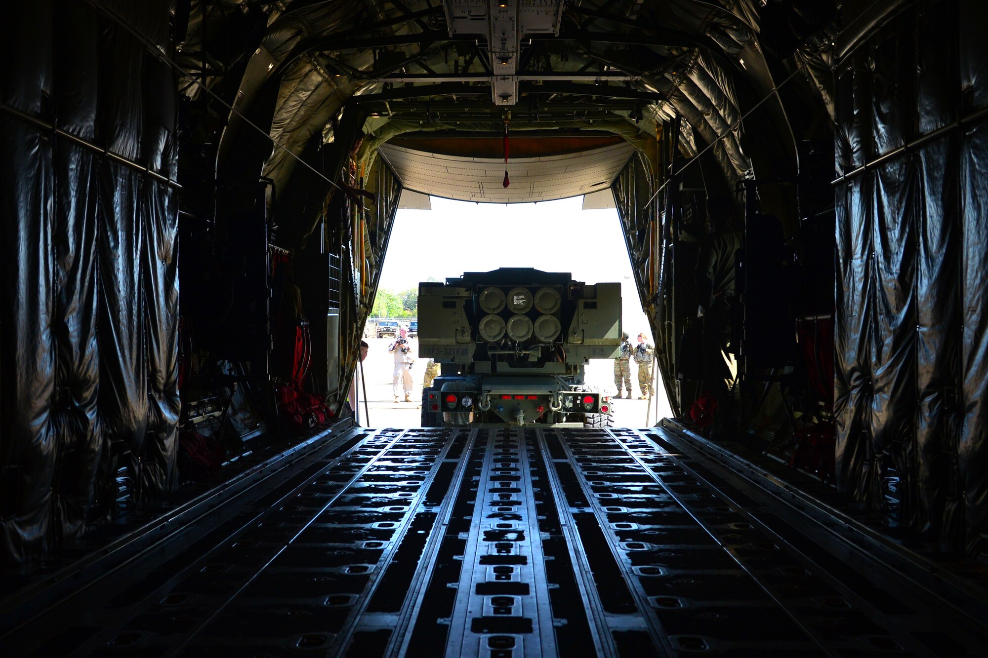 An M142 High Mobility Artillery Rocket System is loaded onto a C130-J during Green Flag Little Rock April 10, 2018, near Alexandria, La. The HIMARS carries six rockets and can launch the entire multiple launch rocket system family of munitions. (U.S. Air Force Photo by Airman 1st Class Codie Collins)
