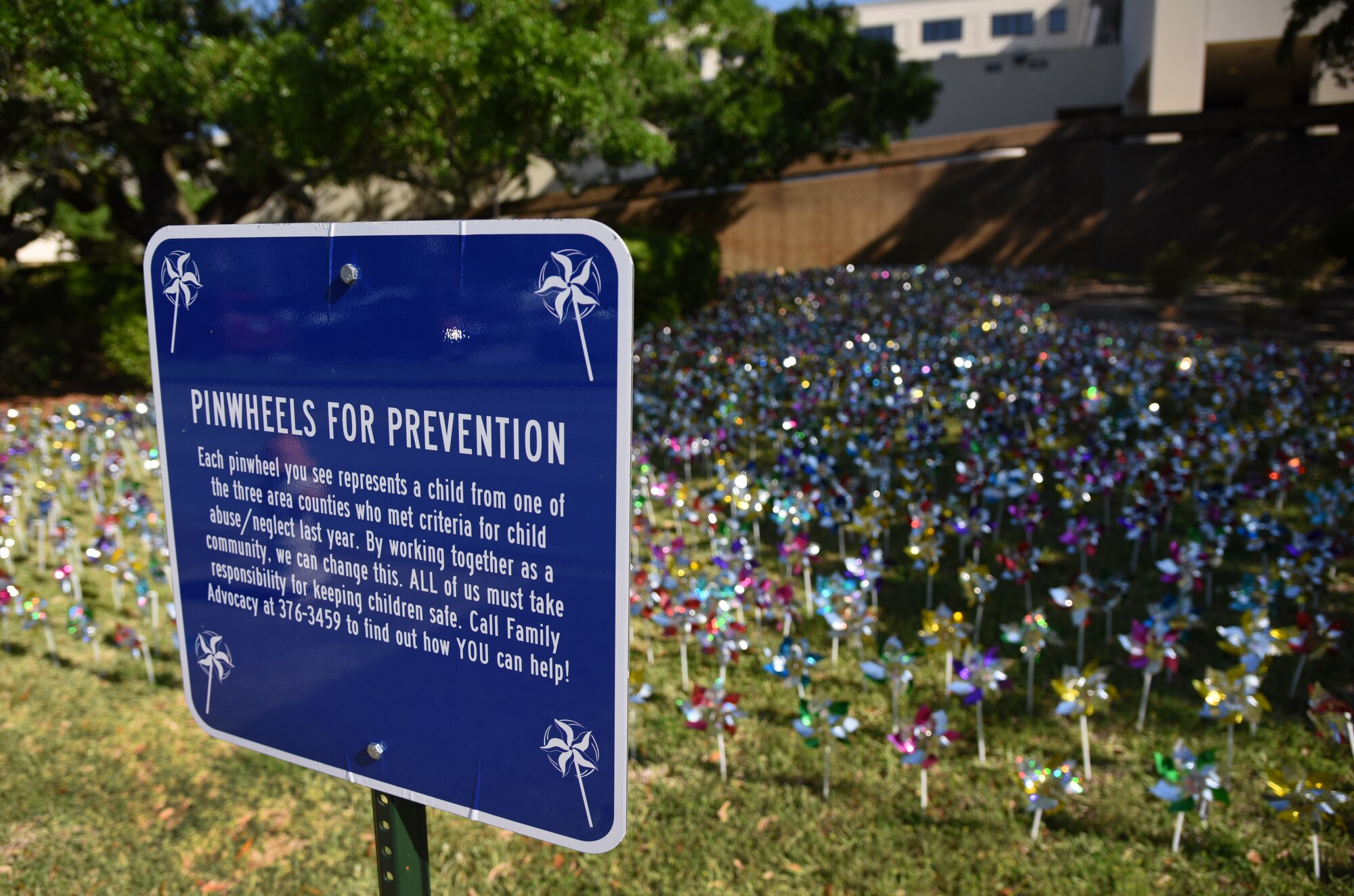 Pinwheels are displayed in front of the Keesler Medical Center at Keesler Air Force Base, Mississippi, April 11, 2018. Members of the 81st Medical Operations Squadron family advocacy and volunteers placed pinwheels to individually represent children in the three area counties who were victims of child abuse or neglect last year. April is National Child Abuse Prevention Month, which focuses on how to prevent child abuse and neglect as well as promoting child and family well-being. (U.S. Air Force photo by Kemberly Groue)
