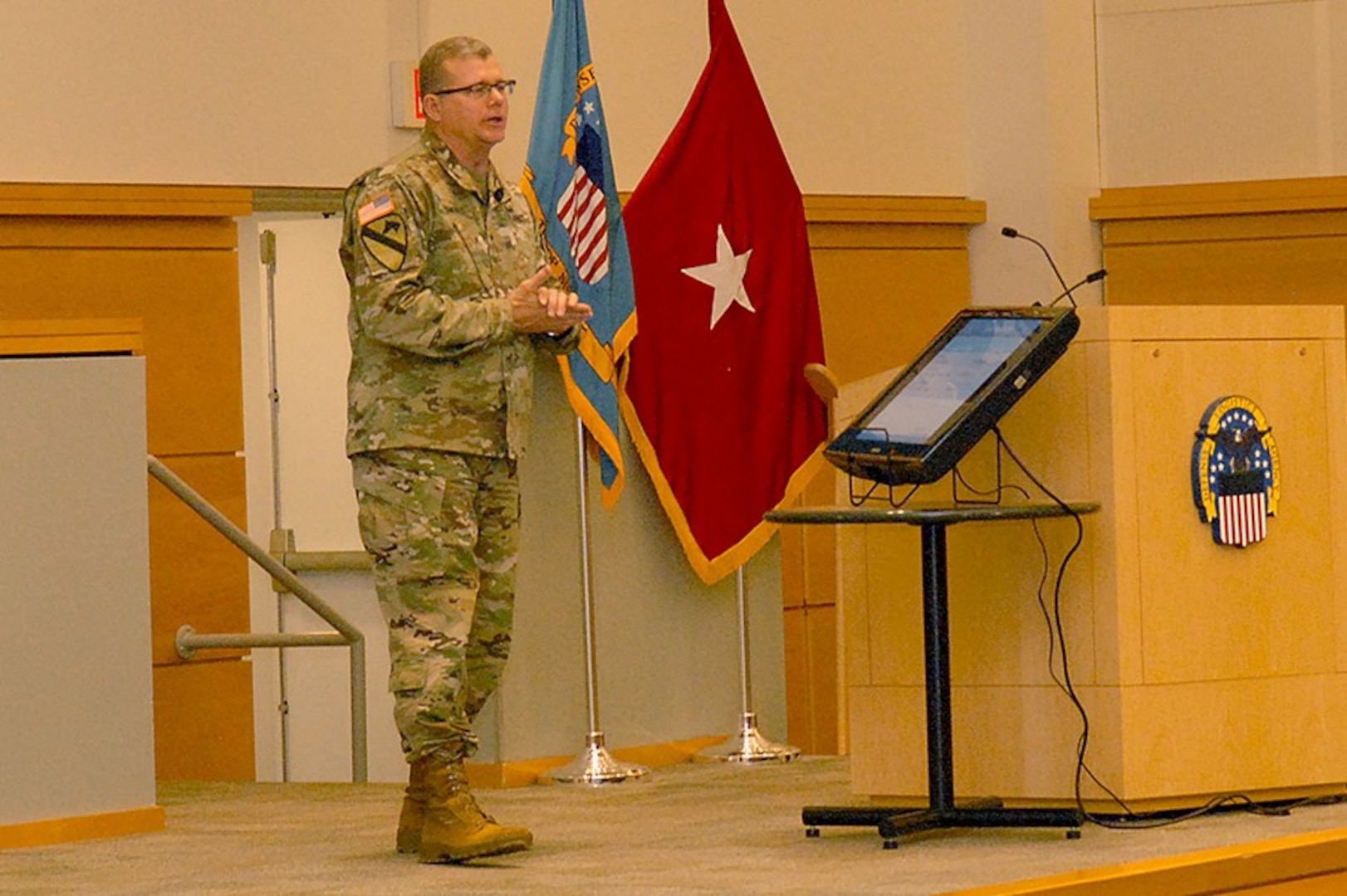 Army Brig. Gen. Mark Simerly, DLA Troop Support commander, addresses his workforce during a town hall event April 5. Simerly compared his employees to the reigning Super Bowl champion Philadelphia Eagles, citing their smarts, toughness and ability to come through in the clutch.