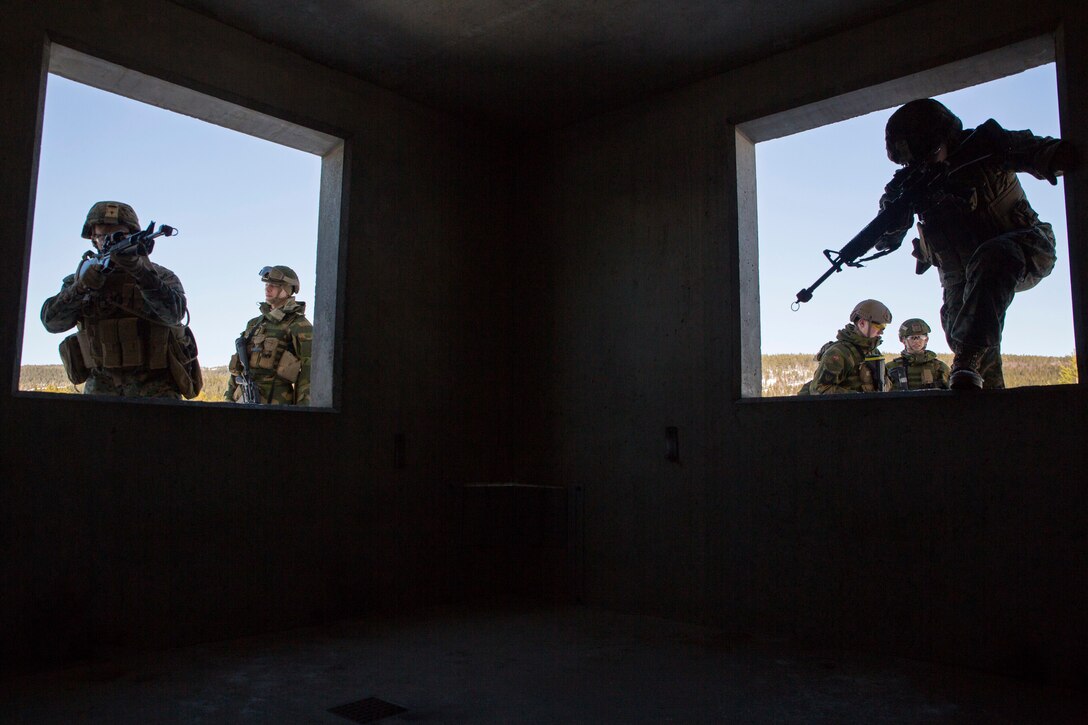 Marines with Marine Rotational Force-Europe 18.1 complete a Norwegian room-clearing technique during close-quarters combat training at Leksdal Skytefelt Training Complex, Norway, March 27, 2018. The law enforcement Marines integrated with Norwegian Home Guard 12 to learn new breaching and clearing tactics. The event is one of many training evolutions the Marines plan to execute with their NATO Allies, enhancing strategic cooperation and partnership between the U.S. and Norway.