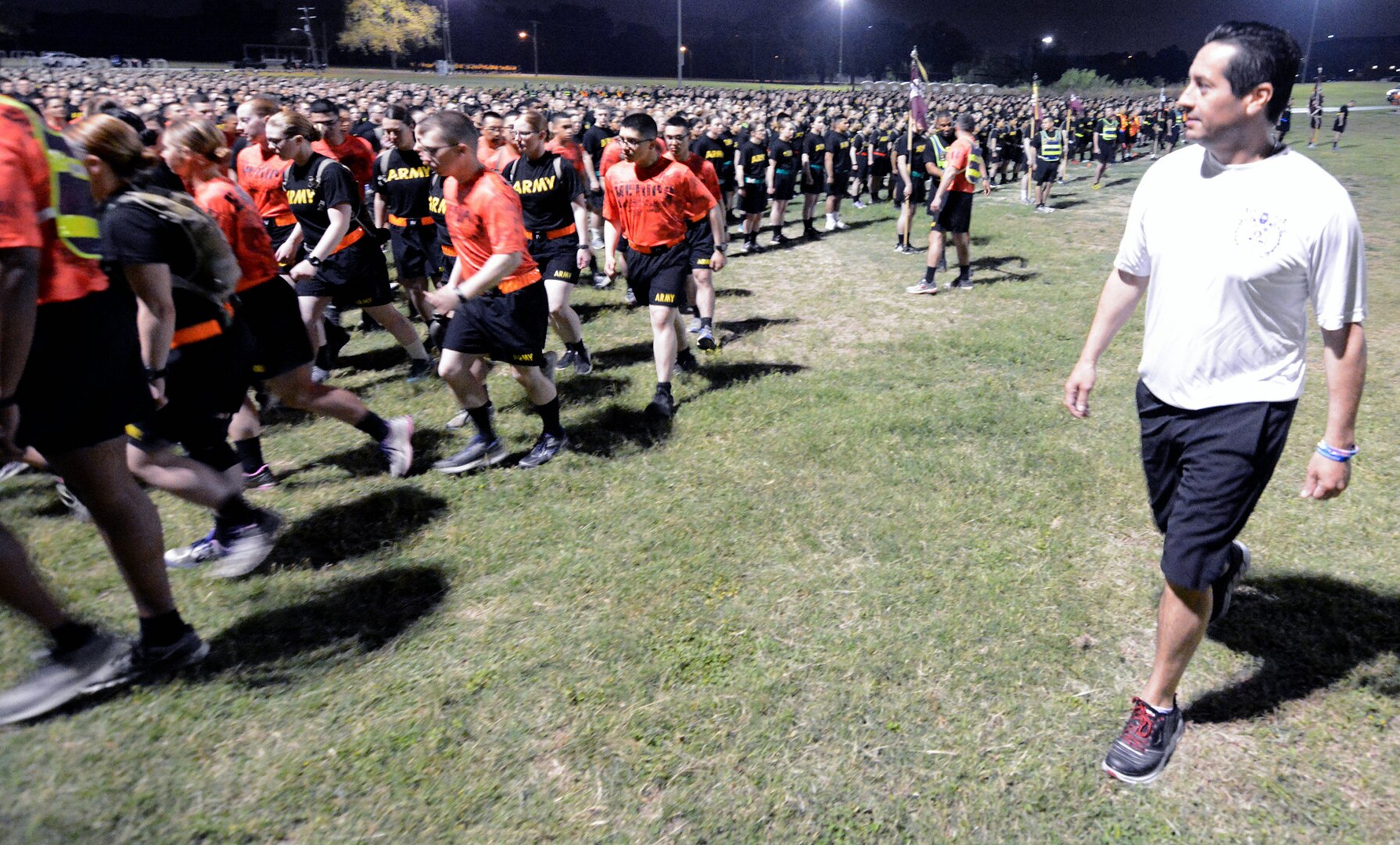 Rey Feo LXX Ken Flores (right), along with other members of Fiesta San Antonio, joined Soldiers for the 32nd Medical Brigade Enlisted Run at Joint Base San Antonio-Fort Sam Houston in the early morning hours April 13. Covering three miles, the dignitaries had the opportunity to run with Soldiers from the 232nd Medical Battalion and 264th Medical Battalion during their morning physical training session.