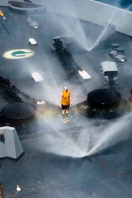 Damage Controlman tests countermeasure wash-down system on forecastle aboard USS Green Bay, Gulf of Thailand, February 9, 2017 (U.S. Navy/Chris Williamson)