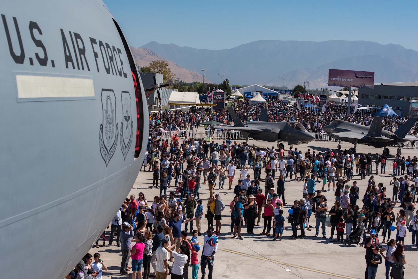 Members of the Chilean public walk through the airshow fairgrounds during the FIDAE 2018 international airshow in Santiago, Chile, April 8, 2018.  U.S. airmen participated in a variety of activities during the air show, including subject matter exchanges with the Chilean Air Force, aerial demonstrations, and interaction with the local community.  (U.S. Air Force photo by Staff Sgt. Danny Rangel)