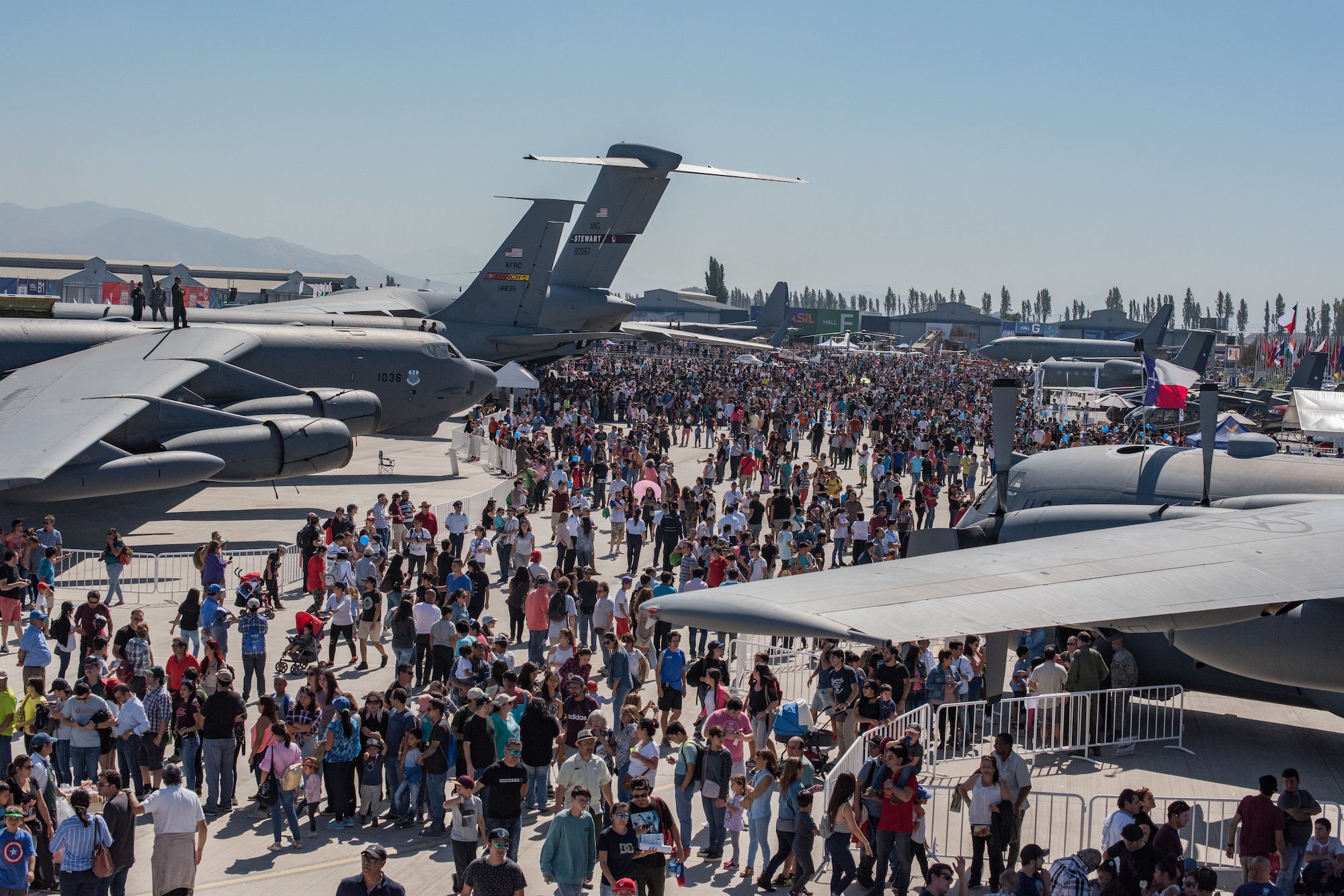 Members of the Chilean public walk through the airshow fairgrounds during the FIDAE 2018 international airshow in Santiago, Chile, April 8, 2018.  U.S. airmen participated in a variety of activities during the air show, including subject matter exchanges with the Chilean Air Force, aerial demonstrations, and interaction with the local community.  (U.S. Air Force photo by Staff Sgt. Danny Rangel)