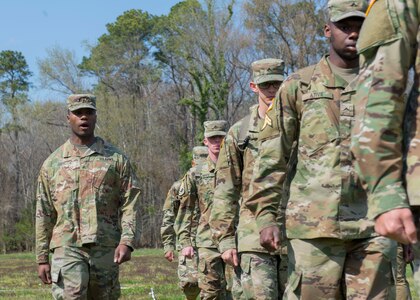 U.S. Army Sgt. Dequan Davis, Medical Department Activity patient administrator, call march commands to Soldiers at Joint Base Langley-Eustis, Virginia., April 10, 2018. Day one of the three-day NCO of the Year and Soldier of the Year competition tested participants on 11 tasks and drills. (U.S. Air Force photo by Airman 1st Class Monica Roybal)