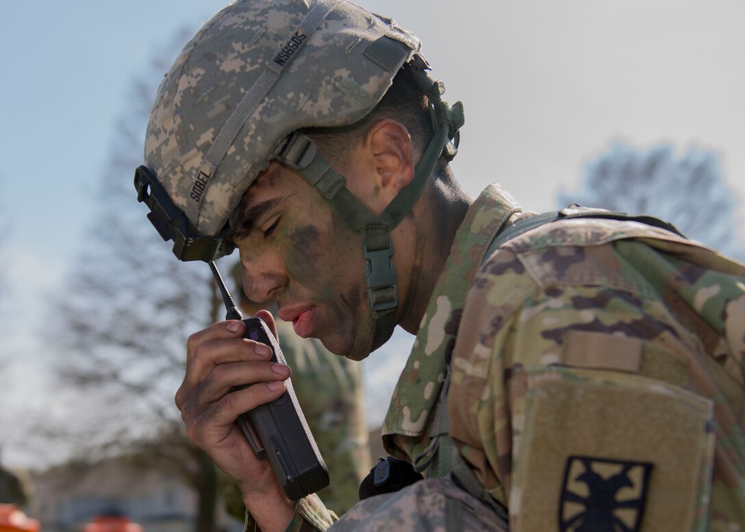 U.S. Army Spc. Nicholas J. Sobel, 567th Inland Cargo Transportation Company, 53rd Battalion, 7th Transportation Brigade (Expeditionary) cargo specialist, talks over a radio Soldiers at Joint Base Langley-Eustis, Virginia., April 10, 2018. Soldiers tested their communication skills during the NCO of the Year and Soldier of the Year competition (U.S. Air Force photo by Airman 1st Class Monica Roybal)