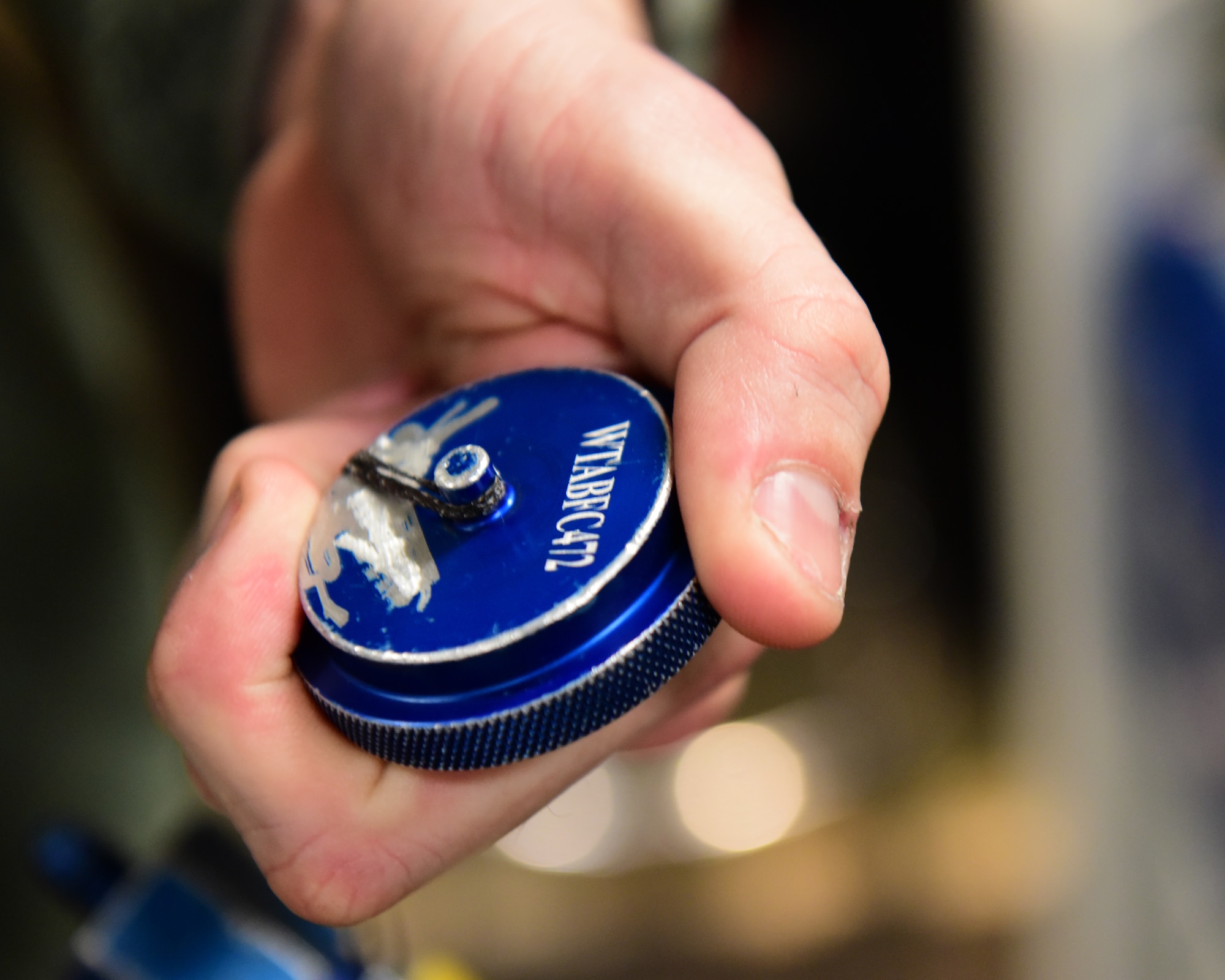 U.S. Air Force Staff Sgt. Randell White, a mobility support technician assigned to the 509th Aircraft Maintenance Squadron, displays a freshly labeled piece of equipment at Whiteman Air Force Base, Mo., April 10, 2018. The AMXS uses a Epilog Laser Fusion M2 machine to create perminate and legibal labels for equpiment used for B-2 Spirits. (U.S. Air Force photo by Staff Sgt. Danielle Quilla)