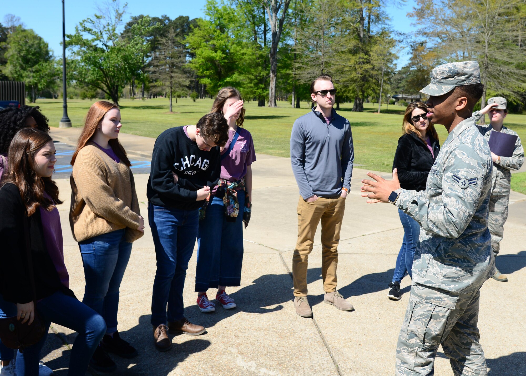 Airman 1st Class Rodney Williams, 14th Operations Support Squadron aviation resource manager, greets the Lowndes Young Leaders during a base tour April 10, 2018, on Columbus Air Force Base, Mississippi. Lowndes Young Leaders is a 12-month leadership program for high school sophomores that live in and attend high school or are homeschooled in Lowndes County, Mississippi. (U.S. Air Force photo by Airman 1st Class Beaux Hebert)