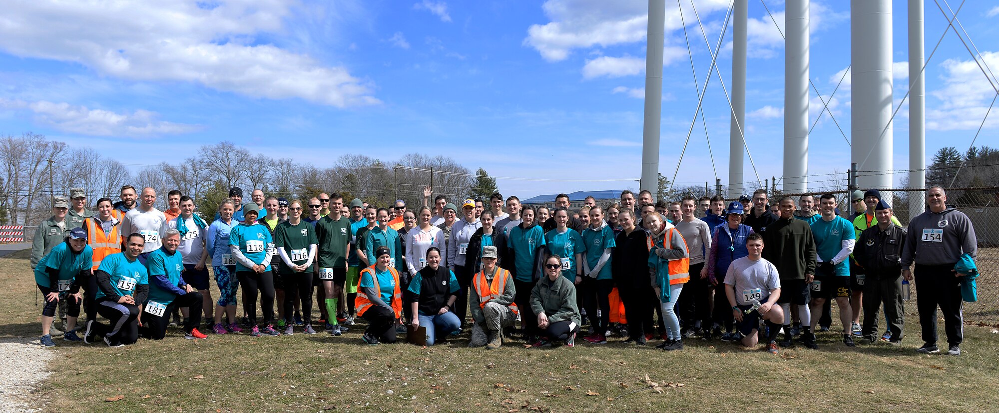 Participants in the Sexual Assault Awareness Month 5K run pose for a photo on April 08, 2018 at Pease Air National Guard Base, N.H. The Sexual Assault Prevention Response Team hosts the annual event. (N.H. Air National Guard photo by Airman 1st Class Victoria Nelson)