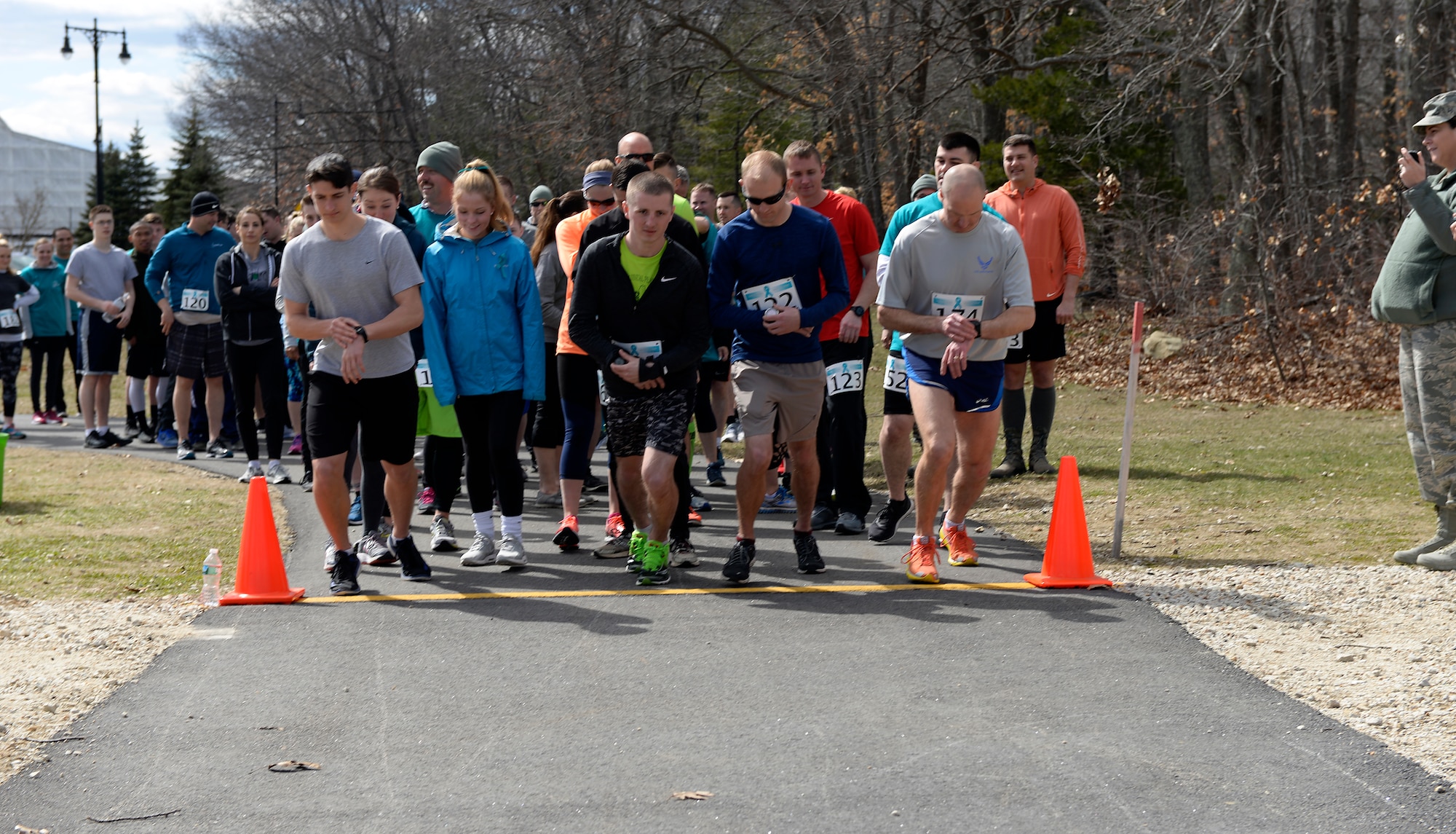 Participants in the Sexual Assault Awareness Month 5K run take off from the starting line on April 08, 2018 at Pease Air National Guard Base, N.H. The Sexual Assault Prevention Response Team hosts the annual event. (N.H. Air National Guard photo by Airman 1st Class Victoria Nelson)