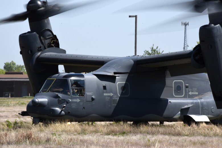 A 20th Special Operations Squadron CV-22 Osprey idles after landing at Goodfellow Air Force Base, Texas, 11 April, 2018. The 20th 20 SOS and the 56th Special Operations Intelligence Squadron personnel were on hand to speak with Goodfellow trainees about the aircraft and how their commands support America's strategic goals. The CV-22 is equipped with integrated threat countermeasures, terrain-following radar, forward-looking infrared sensor and other advanced avionics systems that allow it to operate at low altitude in adverse weather conditions and medium- to high-threat environments.