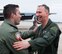 Col. James P. Ryan, retired 157th Air Refueling Wing commander, greets members of the Wing on Feb. 23, 2018 at Pease Air National Guard Base, N.H. Ryan's family and Wingmen met him on the flightline after he took his fini-flight, or final flight, as a member of the Wing before his retirement. (N.H. Air National Guard photo by Staff Sgt. Kayla White)