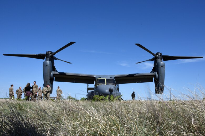A CV-22 Osprey from the 20th Special Operations Squadron rests in a field on Goodfellow Air Force Base, Texas, April 11, 2018. The Osprey carried members from the 20th SOS as well as the 56th Special Operations Intelligence Squadron, which were on hand to answer questions and provide a tour of the aircraft.