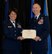 Col. James P. Ryan, retired 157th Air Refueling Wing commander, receives a Legion of Merit certificate from Brig. Gen. Laurie M. Farris, commander of the N.H. Air National Guard, on April 07, 2018 at Pease Air National Guard Base, N.H. Ryan retired after more than 30 years of service. (N.H. Air National Guard photo by Airman 1st Class Victoria Nelson)