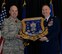 Col. James P. Ryan, retired 157th Air Refueling Wing commander, receives his shadow box from Command Chief Master Sgt. Matthew S. Heiman, the 157th ARW command chief, on April 07, 2018 at Pease Air National Guard Base, N.H. The shadow box serves as a visual representation of Ryan's career, after more than 30 years of service. (N.H. Air National Guard photo by Airman 1st Class Victoria Nelson)