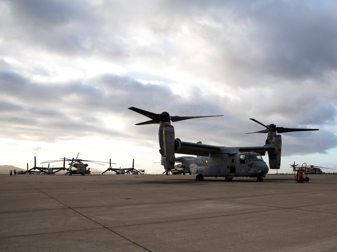 An MV-22B Osprey assigned to Marine Medium Tiltrotor Squadron (VMM) 166 (Reinforced), Marine Aircraft Group 16, 3rd Marine Aircraft Wing, rests on the flight line during sunrise at Marine Corps Air Station Miramar, Calif., April 12. Marine Heavy Helicopter Squadron (HMH) 361, Marine Light Attack Helicopter Squadron (HMLA) 469 and VMM-166 consolidated to become VMM-166 (Rein) for an upcoming combat deployment with the 13th Marine Expeditionary Unit. MCAS Miramar is home to 3rd MAW and 19 of its squadrons. (U.S. Marine Corps photo by Cpl. Becky Calhoun/Released)