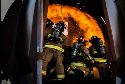 Firefighters from Joint Base San Antonio-Randolph extinguish a fire during training April 11, 2018 at the Camp Talon fire training grounds on JBSA-Randolph. The training takes place quarterly and offers an opportunity for new firefighters to become more confident while fighting fires, but it also gives seasoned Airmen a chance to sharpen their skills and get a head start to the next step in their careers. (U.S. Air Force photo by Senior Airman Gwendalyn Smith)